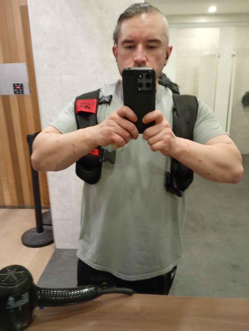 Locker room, gear on, ready to train